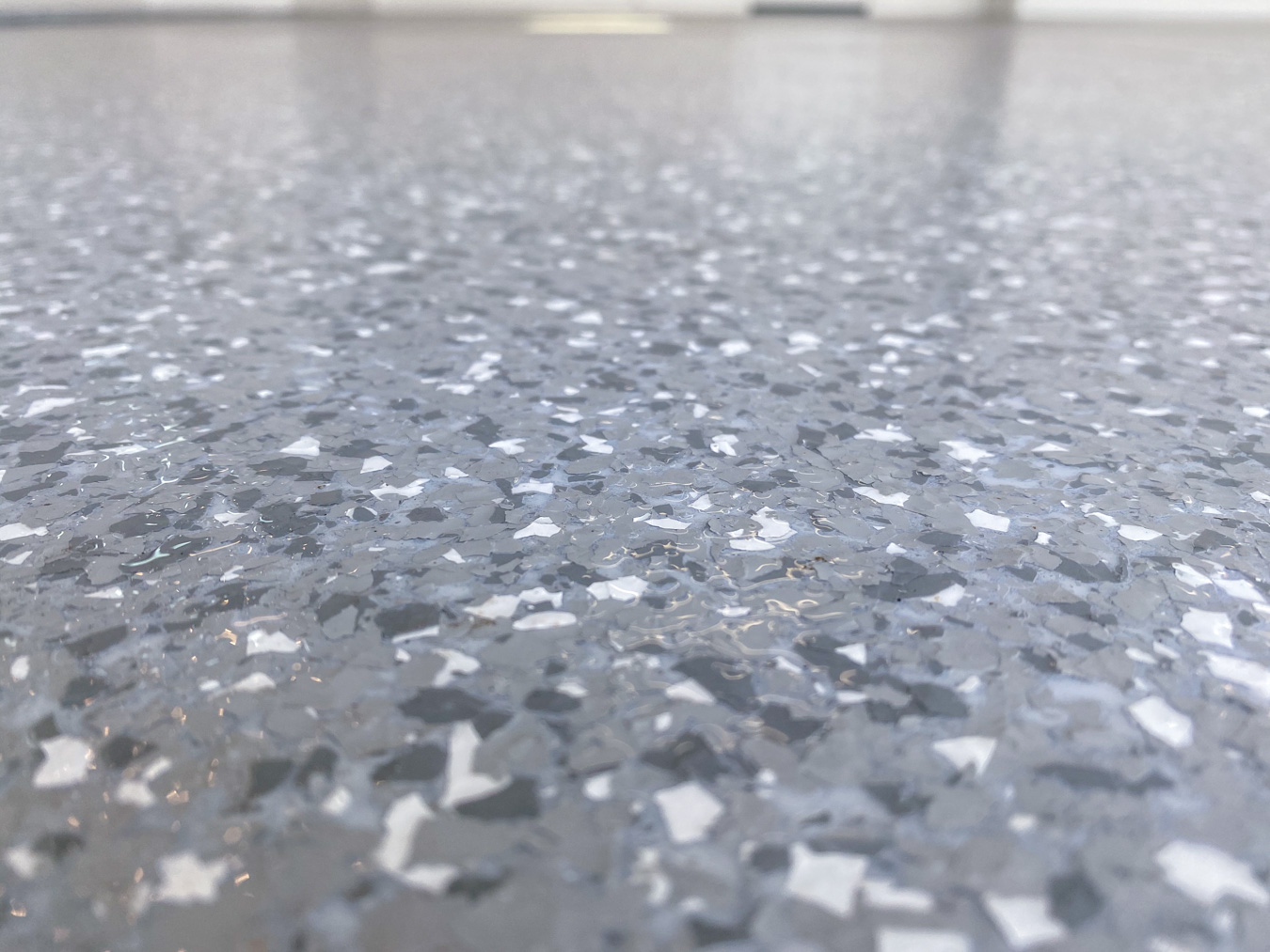 close-up of Gray Epoxy Concrete Coating on a Garage Floor